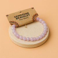 Pulsera de Cuarzo Rosa, elástica con cuentas naturales en tono rosado y piel en contacto directo - Atrae amor y armonía