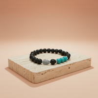 Pulsera lava turquesa: tira elástica con volcánica negra, azul y hoja plateada - enraizamiento y expresión auténtica